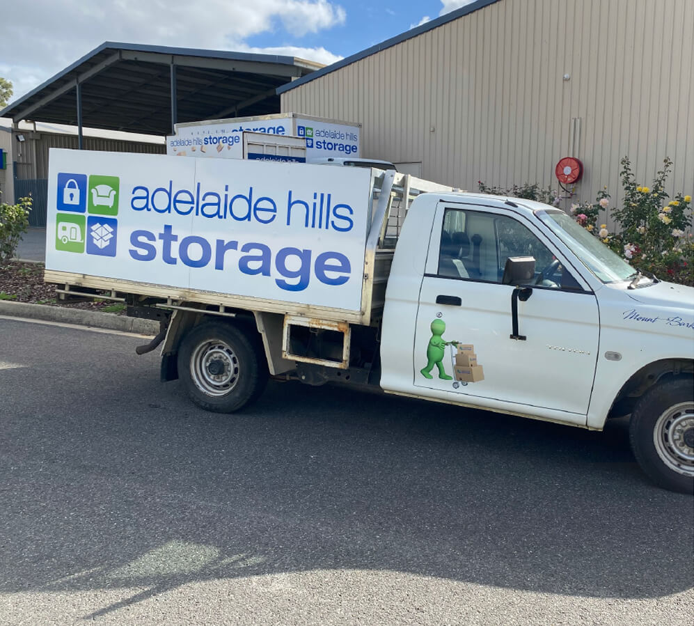Removal ute with smaller storage container in tray