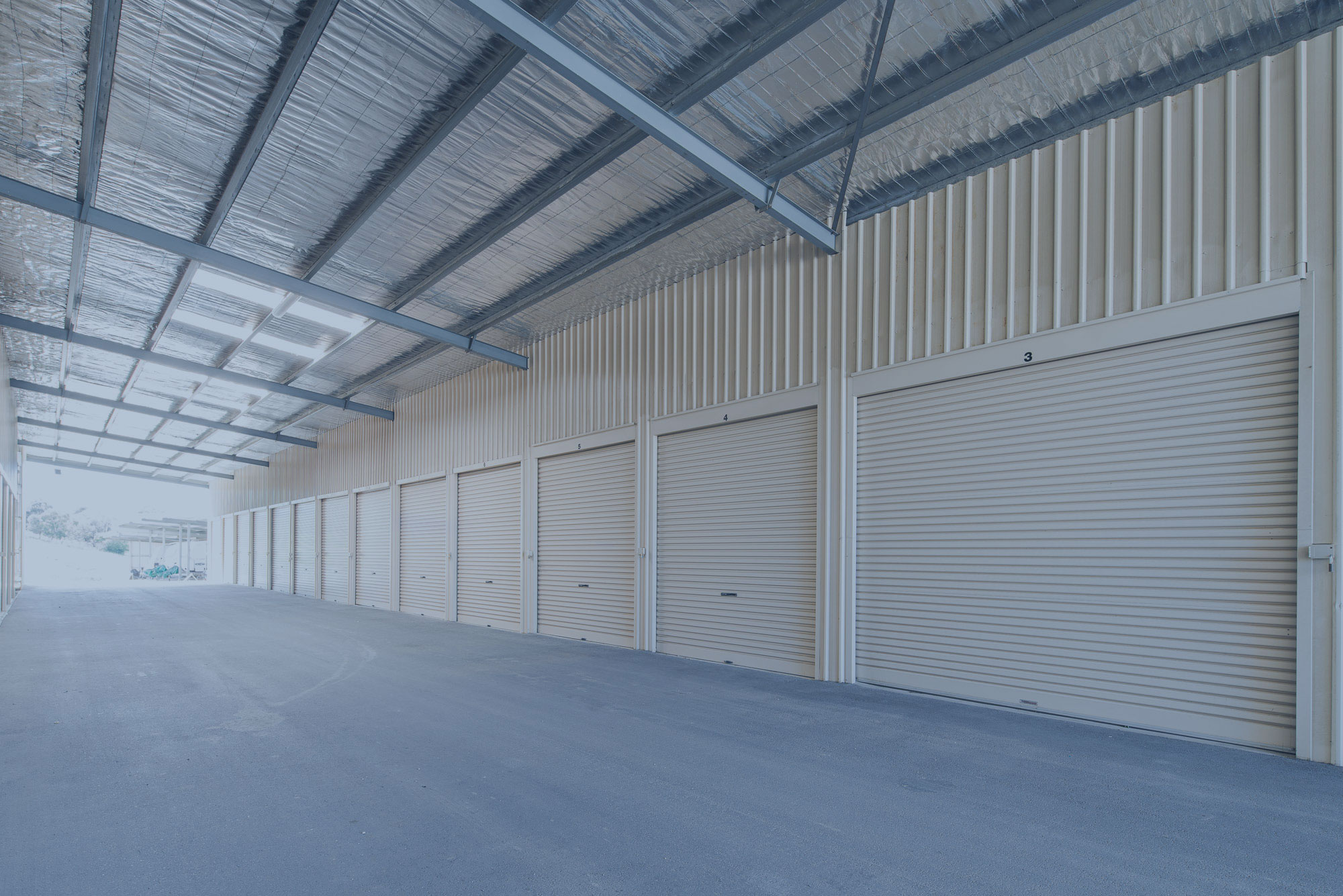 Multiple undercover roller door units