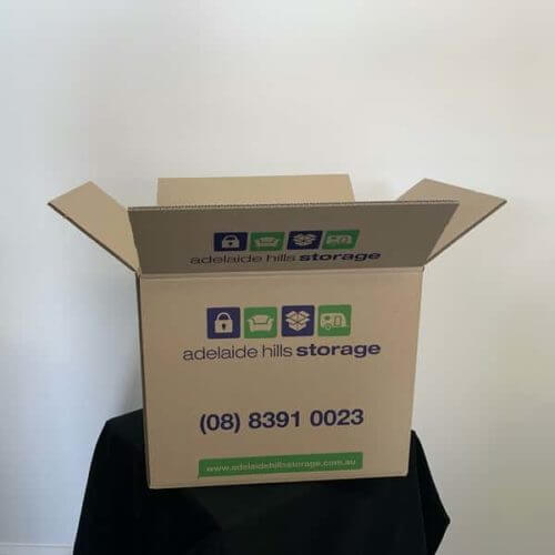 Small storage box with open lid for fragile items