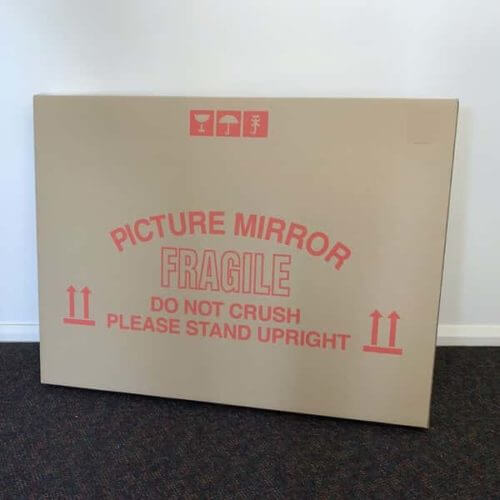 Storage box for fragile items leaning against wall