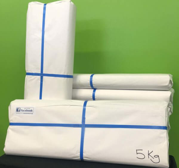 White packing paper wrapped around four items